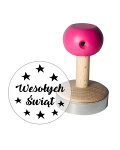 Stempel do ciastek oraz odbicie z napisem "wesołych świąt" i gwiazdami wokół